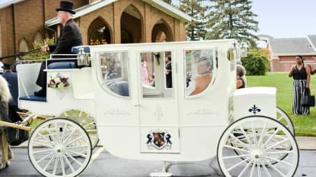 Bride and groom ready for their ride in our Royal Coach in Akron, OH