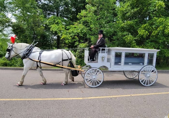  Our one of a kind horse drawn funeral coach during a funeral in Middleburg, OH