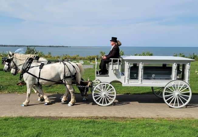 Our handcrafted Funeral Coach during a procession in Erie PA