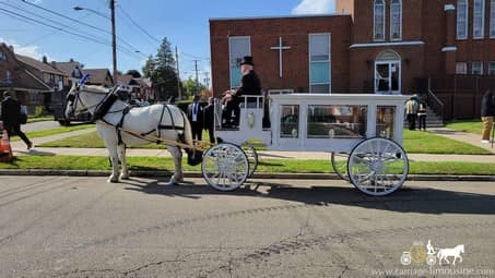 Our handcrafted Funeral Coach during a funeral in Erie, PA